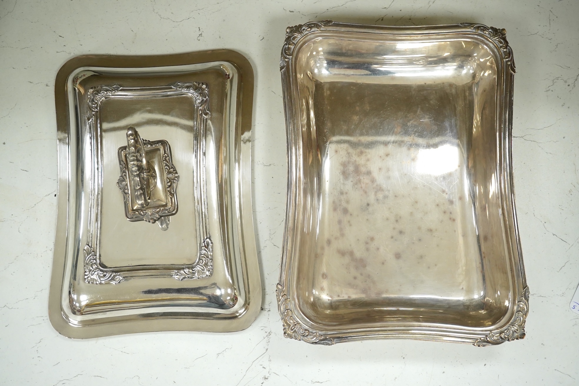 A pair of electroplate entrée dishes and covers, 30cm. Condition - fair to good